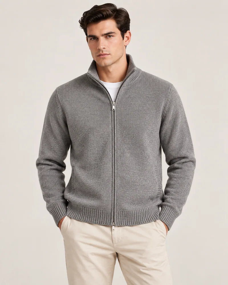 Man wearing a grey zip-up knit sweater